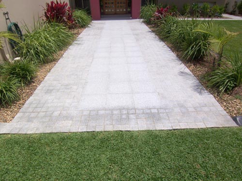 Light Grey Granite stone tile or pool paver shown in situ with matching coping