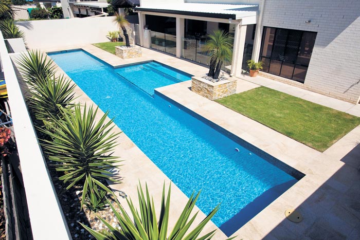 Almond Granite stone tile or pool paver shown in situ with matching coping