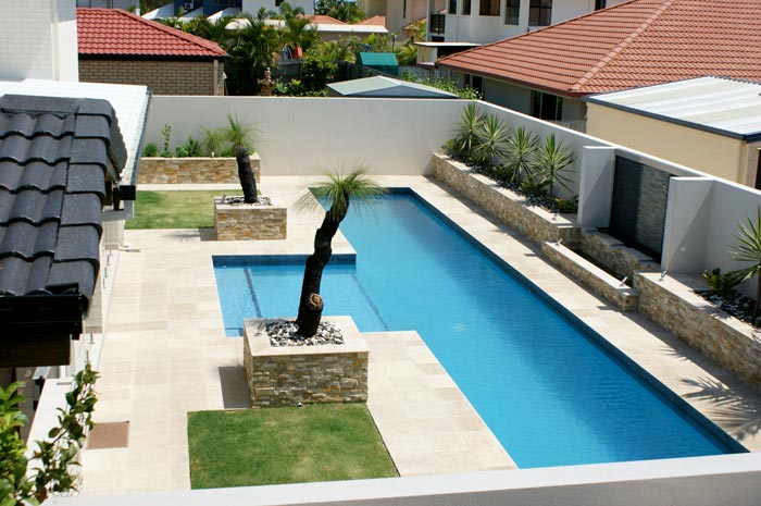 Almond Granite stone tile or pool paver shown in situ with matching coping