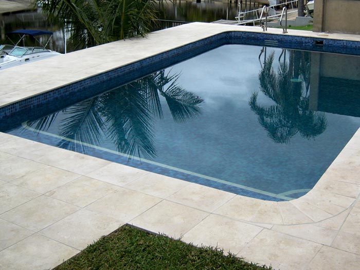 Crema Limestone stone tile or pool paver shown in situ with matching coping