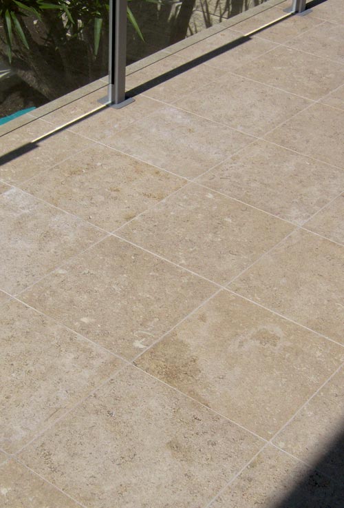 Dune Limestone stone tile or pool paver shown in situ with matching coping