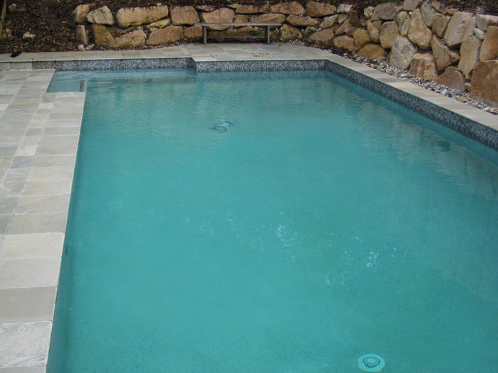 Grey Gum stone tile or pool paver shown in situ with matching coping