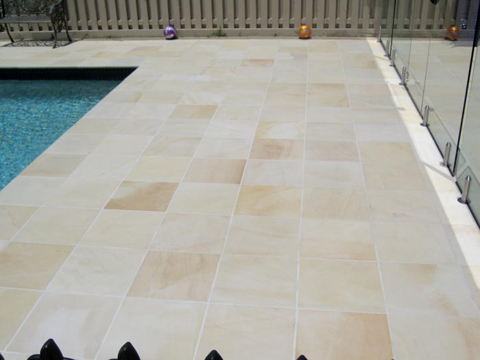 HQDrifting Sand stone tile or pool paver shown in situ with matching coping