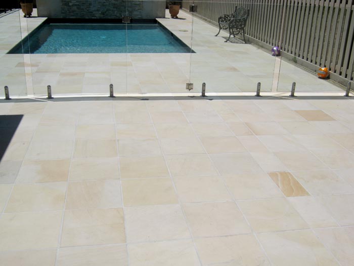 HQDrifting Sand stone tile or pool paver shown in situ with matching coping