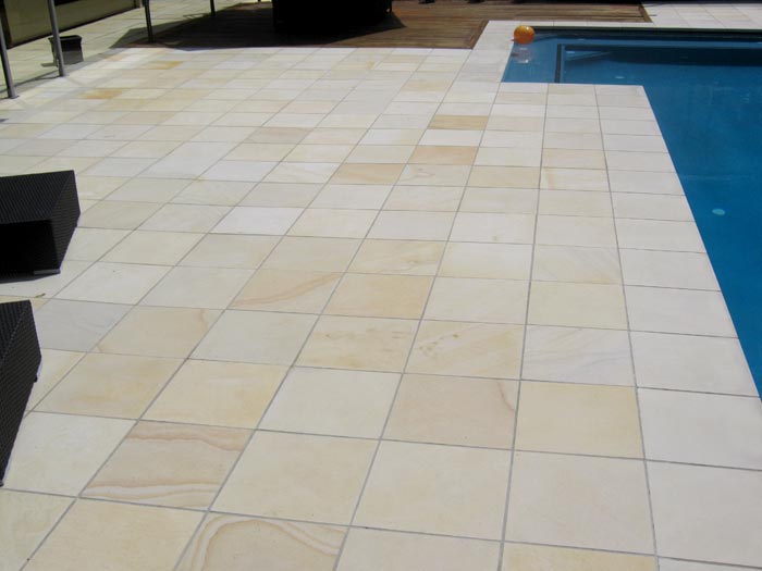 HQDrifting Sand stone tile or pool paver shown in situ with matching coping