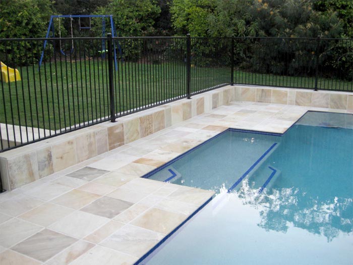 HQ Natural stone tile or pool paver shown in situ with matching coping