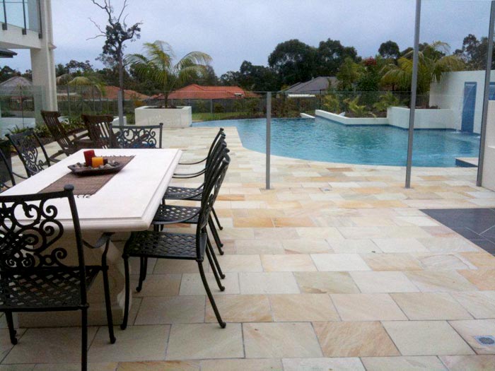 HQ Natural stone tile or pool paver shown in situ with matching coping