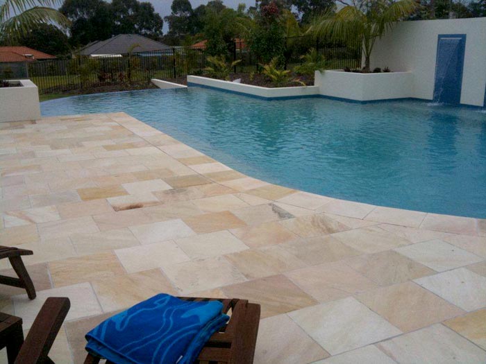 HQ Natural stone tile or pool paver shown in situ with matching coping