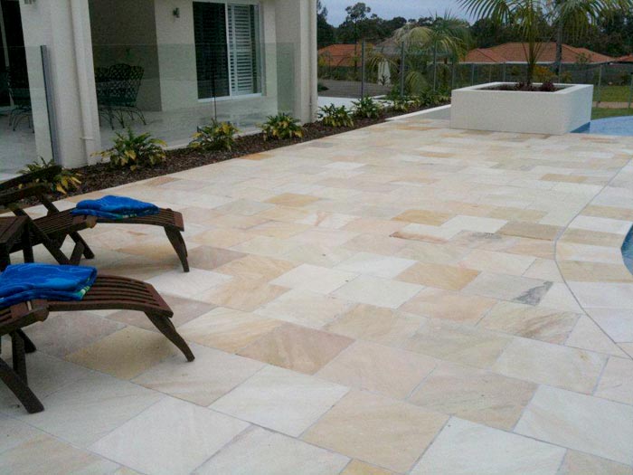 HQ Natural stone tile or pool paver shown in situ with matching coping