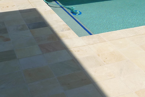 Natural Mint Himalayan Quartz stone tile or pool paver shown in situ with matching coping