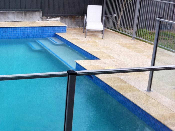 Honey Granite stone tile or pool paver shown in situ with matching coping