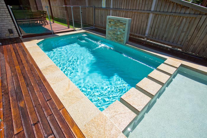 Honey Granite stone tile or pool paver shown in situ with matching coping