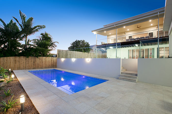 Honey Granite stone tile or pool paver shown in situ with matching coping