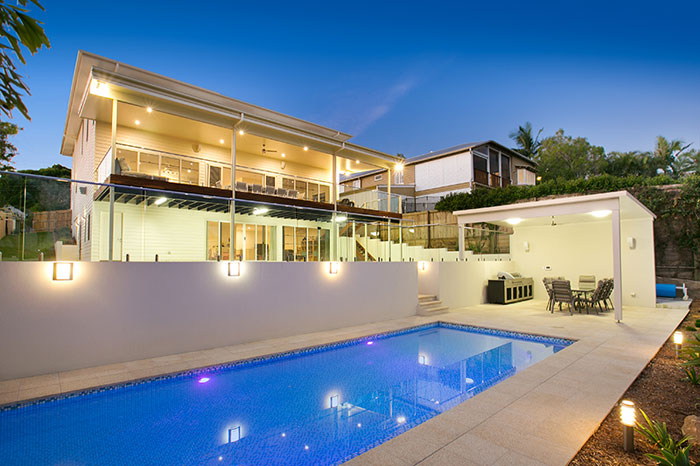 Honey Granite stone tile or pool paver shown in situ with matching coping