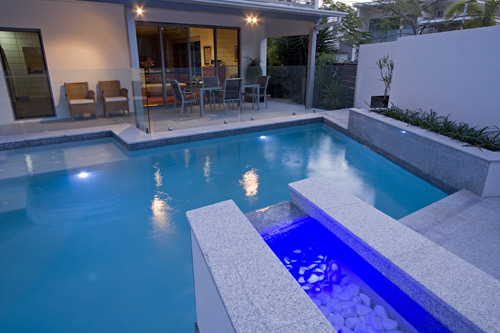 Light Grey Granite stone tile or pool paver shown in situ with matching coping