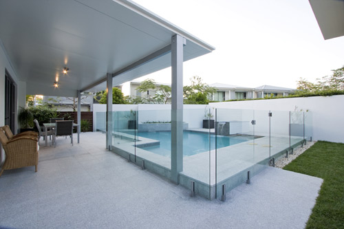 Light Grey Granite stone tile or pool paver shown in situ with matching coping