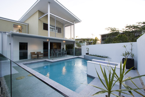 Light Grey Granite stone tile or pool paver shown in situ with matching coping