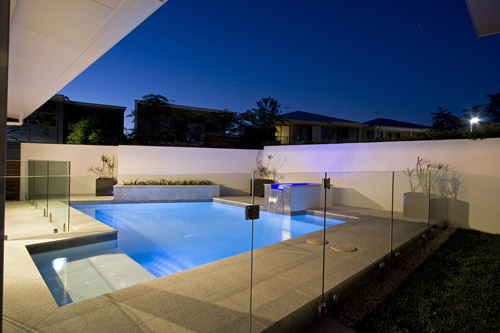 Light Grey Granite stone tile or pool paver shown in situ with matching coping