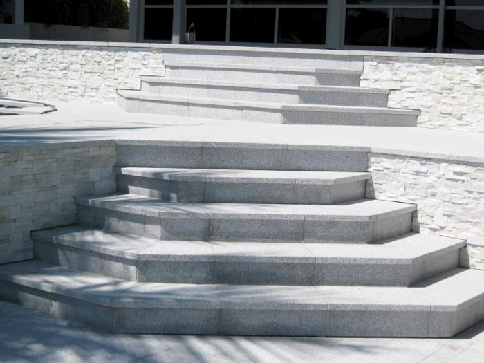 Light Grey Granite stone tiles shown here being used for a stepped terrace in a domestic environment