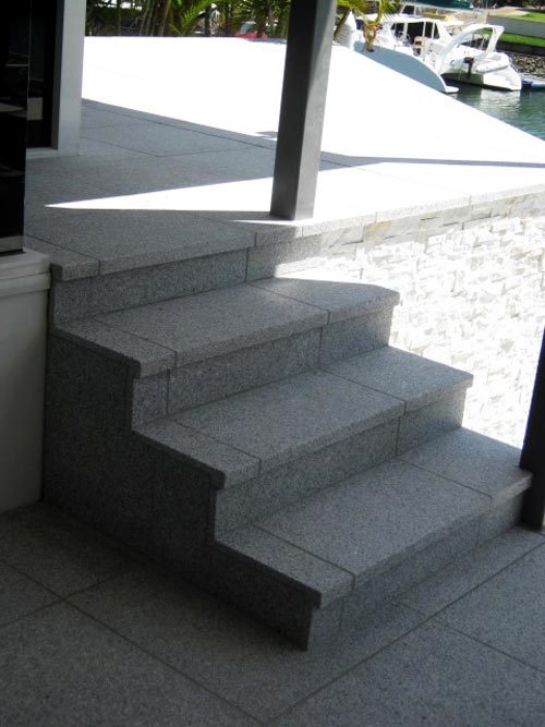 Light Grey Granite Staircase shown in situ with matching coping