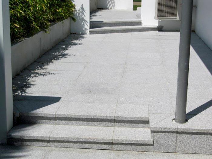 Light Grey Granite stone tiles shown here being used for steps and paving in a domestic environment