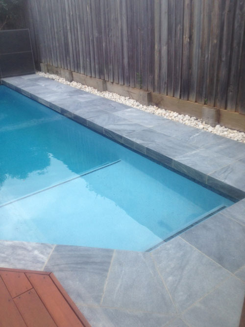 Parisian Blue stone tile or pool paver shown in situ with matching coping