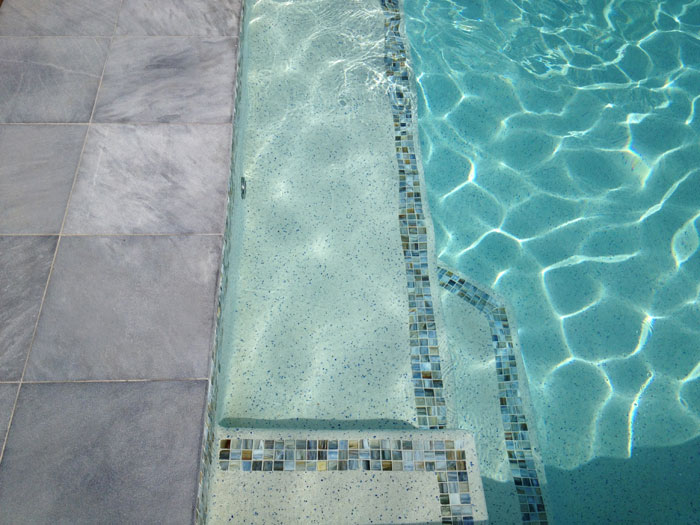 Parisian Blue stone tile or pool paver shown in situ with matching coping