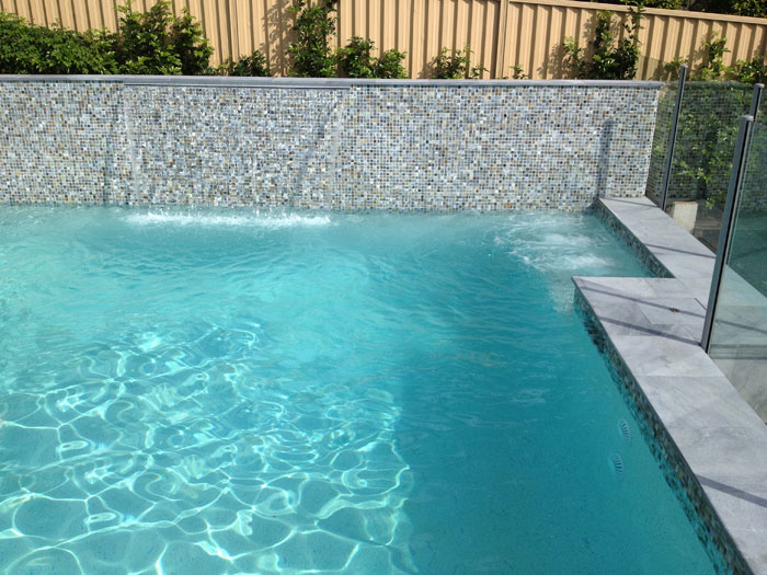 Parisian Blue stone tile or pool paver shown in situ with matching coping