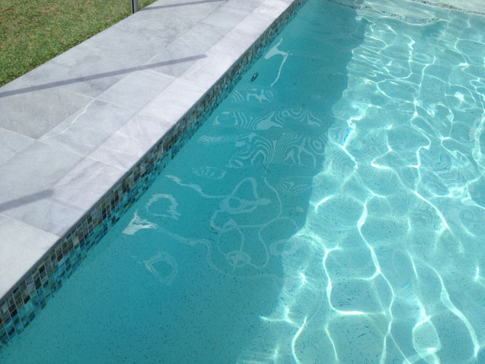 Parisian Blue stone tile or pool paver shown in situ with matching coping