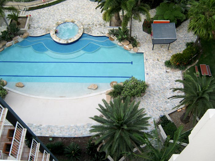 Quartzite stone tile or pool paver shown in situ with matching coping