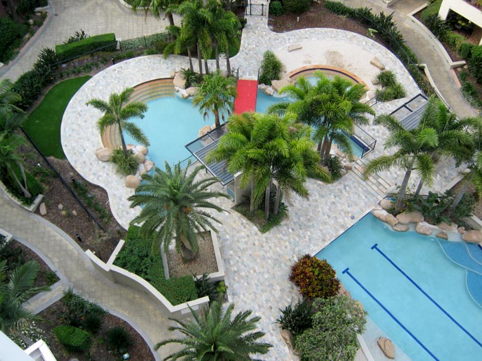 Quartzite stone tile or pool paver shown in situ with matching coping