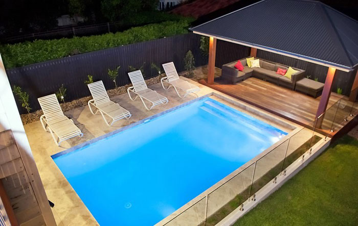 Silver Marble stone tile or pool paver shown in situ with matching coping