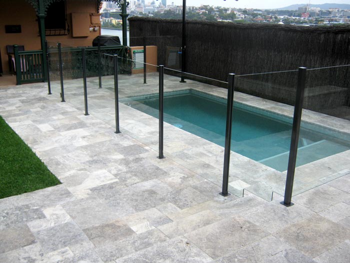 Silver Travertine Tumbled Unfilled stone tile or pool paver shown in situ with matching coping