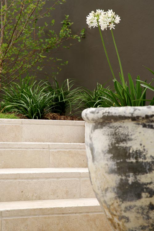 Travertine Linen Stone steps and facing tiles with ornamental vase