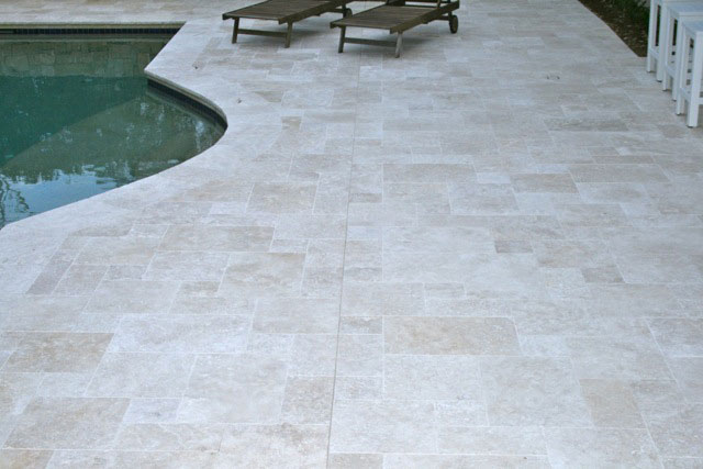 Travertine Linen stone tiles and coping around  swimming pool