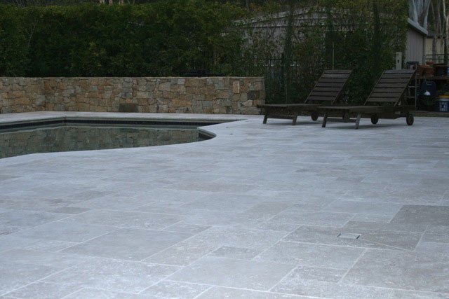 Travertine Linen stone tiles and coping around  swimming pool