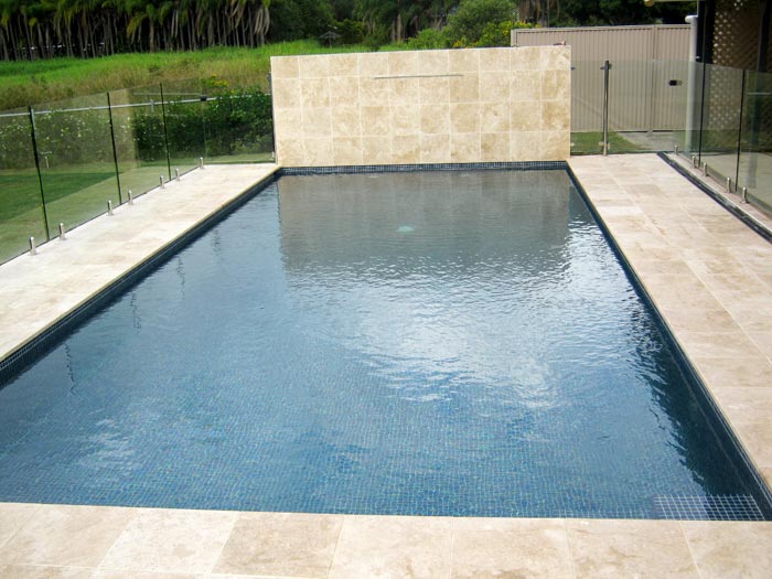 Travertine Linen stone pool feature wall and tiling and coping