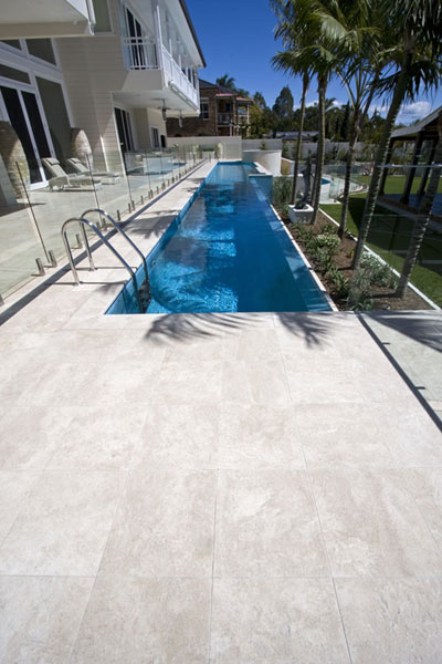 Travertine Linen stone pool tiling shown in situ with matching coping