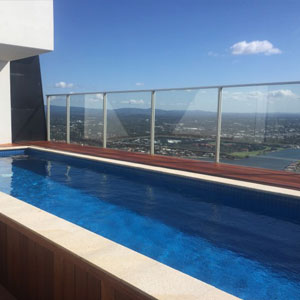 Fully tiled in Azure Blue Crystal with Almond Granite Coping tiles