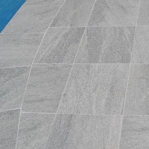 Cosmos Granito tiles shown around a pool