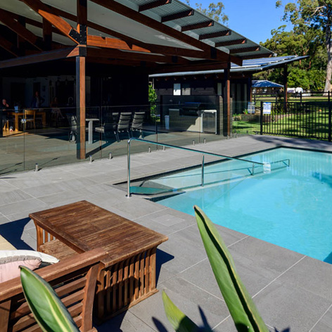 Jupiter porcelain tiles shown tiling a pool surround