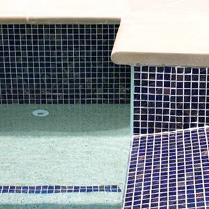 GC125 Dark Blue Gold glass mosaic pool tiles in place