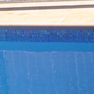 waterline mosaic pool tiles in place