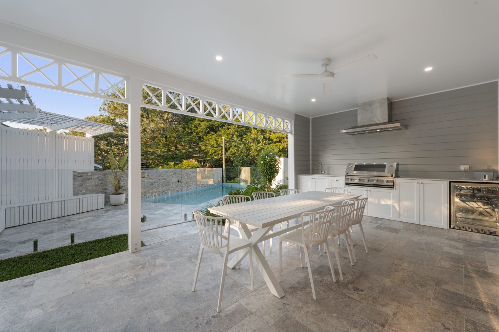 Silver Travertine walling, Silver Travertine coping and surrounds and Ice Blue waterline