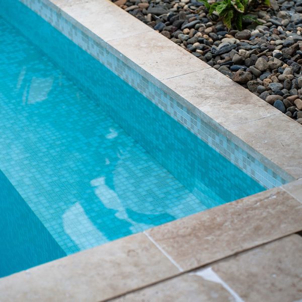 Linen Travertine coping + fully-tiled in GC240 Seashell