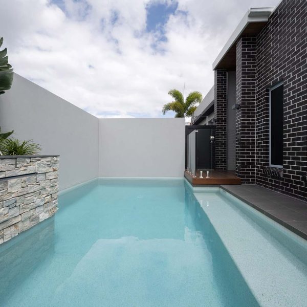 Meteor Granito Porcelain pool coping and surrounds with Thredbo walling and White Crystal waterline tile