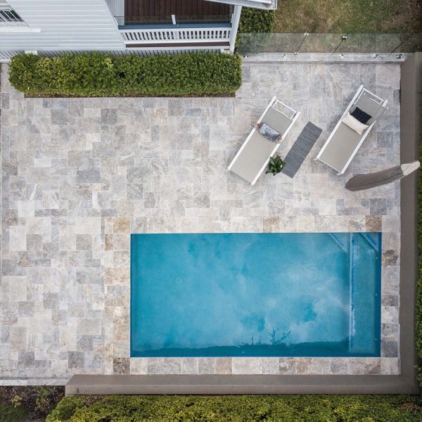 Silver Travertine pool coping and french pattern surrounds